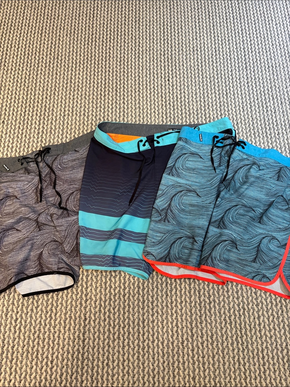 Three pairs of Hurley swim trunks
